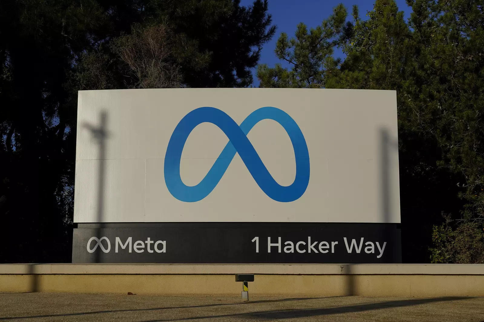Meta's logo can be seen on a sign at the company's headquarters in Menlo Park, Calif.