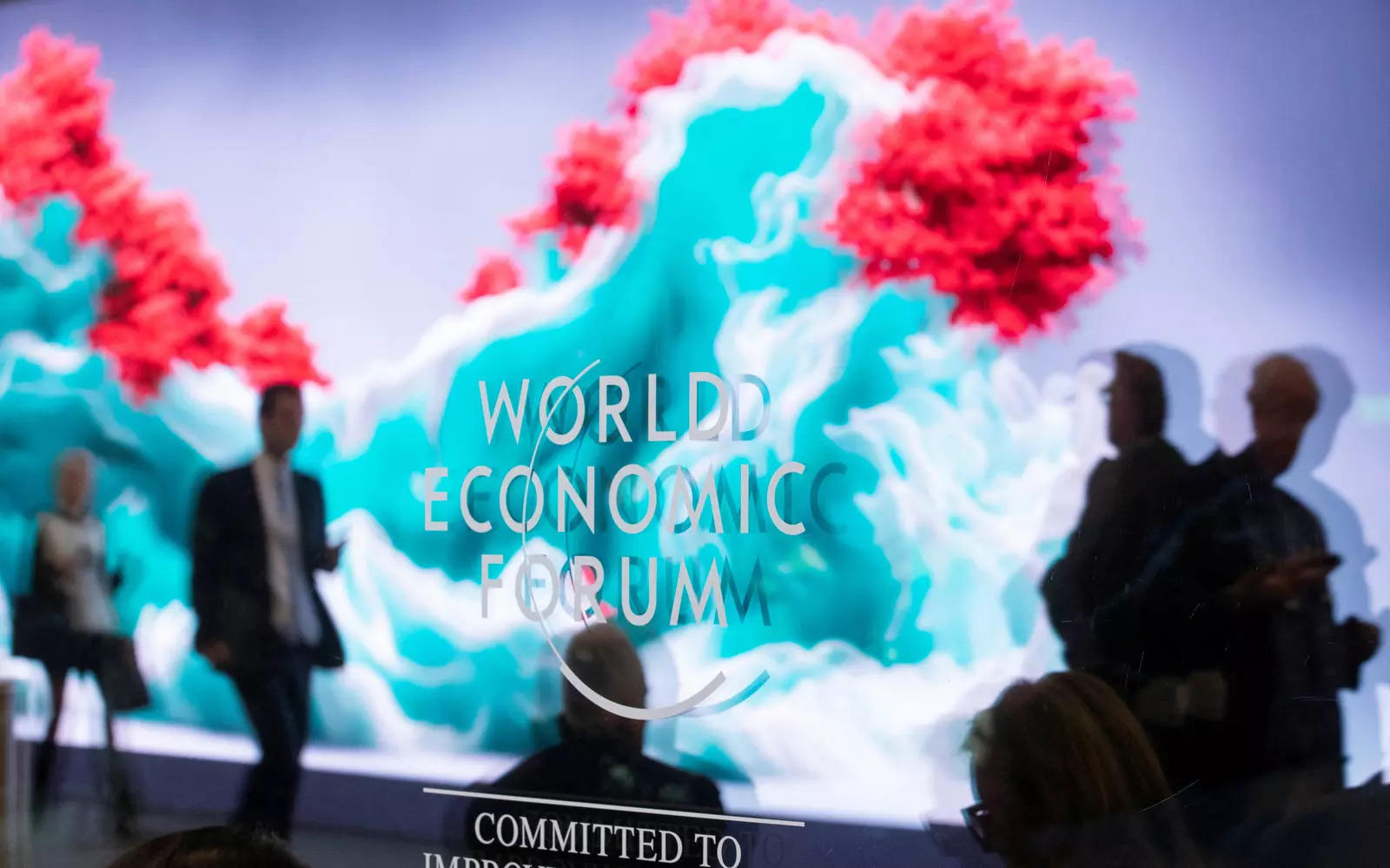  The data sculpture "Artificial Realities: Coral" by Turkish-born artist Refik Anadol is reflected in a window at Davos Congress Centre, the venue of the World Economic Forum (WEF) 2023, in the Alpine resort of Davos, Switzerland, January 17, 2023. REUTERS/Arnd Wiegmann